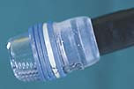 Figur 1    Speedband Multiple Band Ligator med fem gummistrikker spent opp p&aring; en transparent plastsylinder, som er montert&hellip;